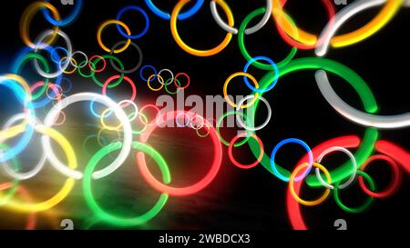 Poznan, Polonia, 7 gennaio 2024: Anelli olimpici simbolo al neon. Lampadine colorate per insegne dei Giochi Olimpici internazionali. Illustrazione 3d del concetto astratto. Foto Stock