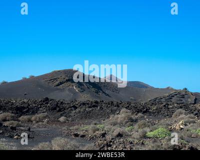 Viste spettacolari delle montagne di fuoco del Parco Nazionale di Timanfaya, quest'area unica composta interamente da terreni vulcanici. Lanzarote Foto Stock