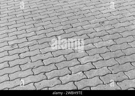 Sfondo piastrellato in cemento grigio, motivo lastre di pavimentazione Foto Stock