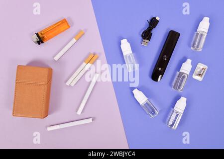 Confronto tra sigaretta elettronica e vera con utensili Foto Stock