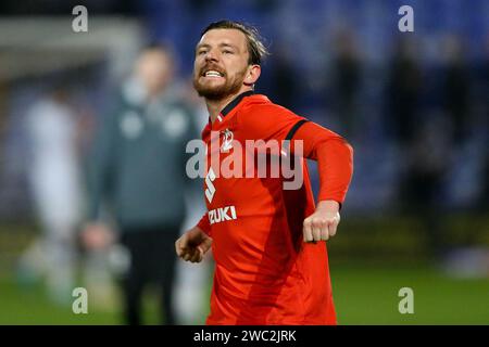 Birkenhead, Regno Unito. 13 gennaio 2024. Alex Gilbey di Milton Keynes Dons celebra la vittoria alla fine della partita. EFL Skybet Football League Two Match, Tranmere Rovers contro MK Dons a Prenton Park, Birkenhead, Wirral sabato 13 gennaio 2024. Questa immagine può essere utilizzata solo per scopi editoriali. Solo per uso editoriale, .pic di Chris Stading/ Credit: Andrew Orchard fotografia sportiva/Alamy Live News Foto Stock