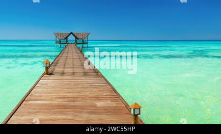 Un molo su un'isola di vacanze, Maldive Foto Stock