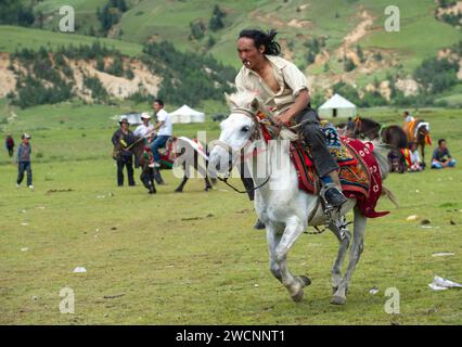 Tibet, Kham, Litang. Nomadi tibetani alla festa dei cavalli. Foto Stock