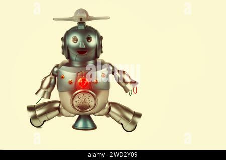 Robot giocattolo vintage su sfondo beige. Robotica. Foto Stock