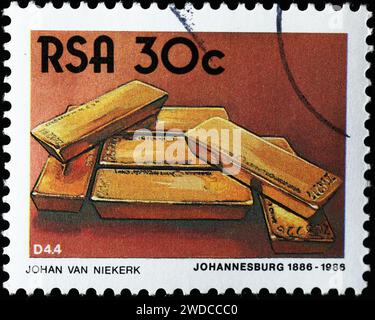 Barre d'oro sul francobollo sudafricano Foto Stock