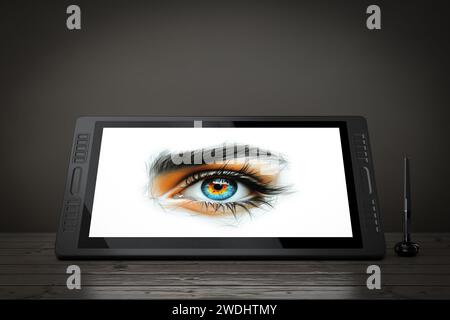 Monitor tablet per disegno grafico digitale di grandi dimensioni con penna e disegno astratto di un occhio femmina dai colori vivaci su un tavolo di legno. Rendering 3D. Foto Stock