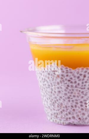 dessert with cream cheese, chia seeds and mango in a clear glass Stock Photo