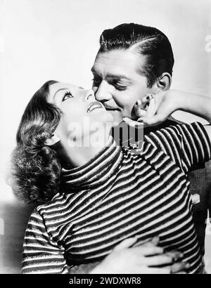 Joan Crawford e Clark Gable in Chained (1934) Foto Stock