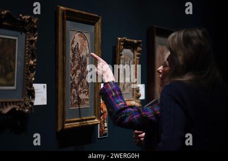 New York, USA. 26 gennaio 2024. Una persona indica un dipinto intitolato "la Madonna e il bambino che appare ai Santi Abrosio" di Carlo Maratti (1625-1713) in mostra alla collezione "Masters Week" di Sotheby, New York, NY, 26 gennaio 2024. L'asta inizia alle 10:00 EST del 1° febbraio. (Foto di Anthony Behar/Sipa USA) credito: SIPA USA/Alamy Live News Foto Stock