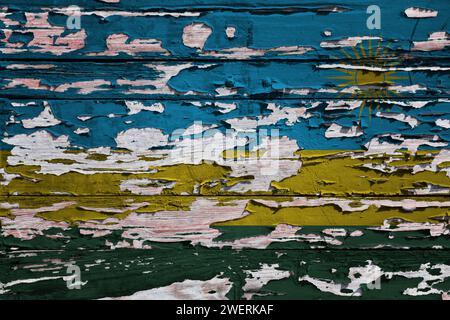 Bandiera del Ruanda dipinta su una tavola di legno grunge. Foto Stock