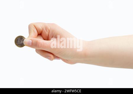 Colpo corto di una mano di donna irriconoscibile che mette una moneta in euro isolata su uno sfondo bianco Foto Stock