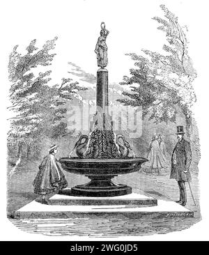 La fontana del Regent's Park, [Londra], 1862. Sotto la direzione del primo Commissario dei lavori pubblici di sua Maestà, l'onorevole W. Cowper, una fontana per bere e' stata recentemente eretta nel Regent's Park, su progetto del professor Westmacott, R.A., e' stata eseguita dal signor J. Sherwood Westmacott. La struttura è costituita da una tazza di ardesia smaltata nera, 7 piedi. Di diametro, poggiato su due gradini di pietra di Portland, di cui il più basso è 11ft. quadrato. Sulla tazza ci sono due cigni elettrotipo, dalle cui bollette viene proiettata l'acqua. Sopra di questi c'è una colonna e base di granito rosso, surmo Foto Stock