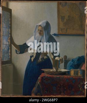 Giovane donna con un lanciatore d'acqua Johannes Vermeer CA. 1662 pittura barocca Foto Stock