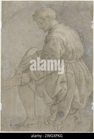 Uomo seduto che indossa la sua calza, Alessandro Allori, 1545 - 1572 carta da disegno. spazzola per gesso Foto Stock