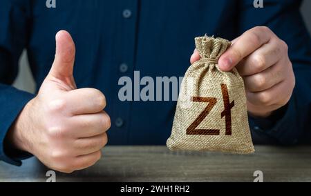 L'uomo approva l'accordo o il prestito. Utili che generano risparmi sui depositi. Pollice e sacca per soldi lucida. Accordo da assumere per un lavoro presso il of Foto Stock