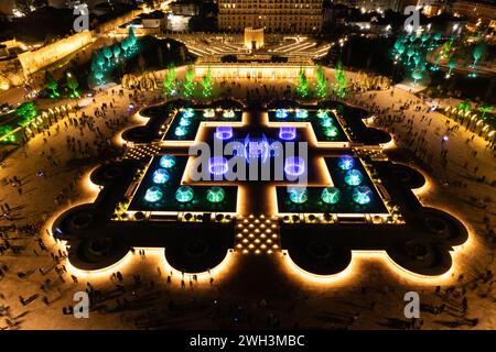 Aerial view to largest light and music fountain in Russia. 2214 colours jets burst into sky with musical accompaniment. Night show fire on the water i Stock Photo