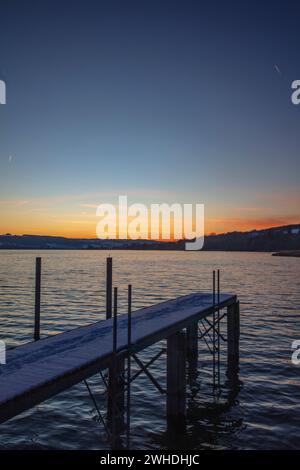 Lago di Costanza, inverno, neve, tramonto, molo Foto Stock
