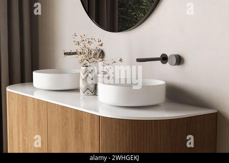 Primo piano di un doppio lavandino con specchio ovale in piedi su una parete beige, lavandino in legno con rubinetto nero nella stanza da bagno minimalista. Vista laterale Foto Stock