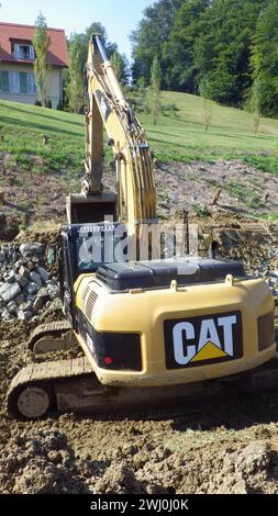 Escavatore a marchio Caterpillar Foto Stock