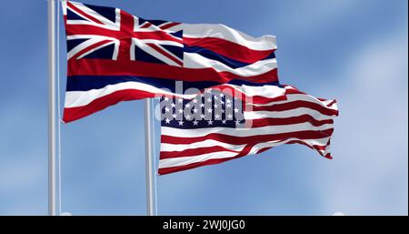 Bandiera dello stato delle Hawaii che sventola con la bandiera nazionale degli Stati Uniti d'America Foto Stock