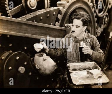 Scena cinematografica da tempi moderni - Charlie Chaplin - di Max Munn Autrey (United Artists, 1936) Foto Stock