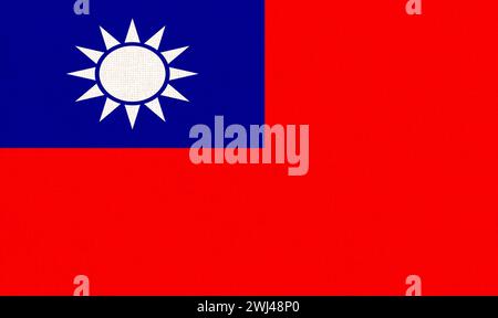Repubblica di Cina. ROC. Bandiera nazionale del tessuto di Taiwan su fondo tessile. Simbolo di internaziona Foto Stock