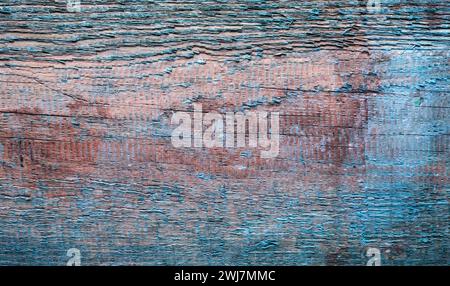 La struttura della vecchia tavola con vernice blu sbucciante. Può essere utilizzato come sfondo. Foto Stock