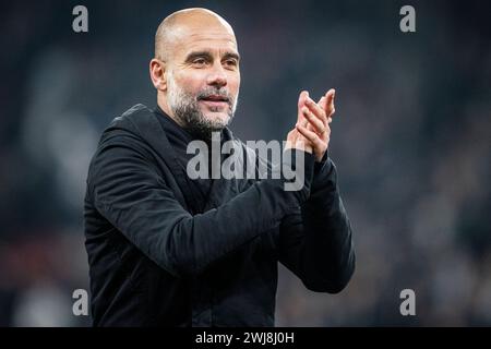 Il capo allenatore del Manchester City Pep Guardiola dopo che il Copenhagen ha incontrato il Manchester City nel turno di UEFA Champions League 16 1a tappa a Parken, Copenhagen, martedì 13 febbraio 2024. (Foto: Mads Claus Rasmussen/Ritzau Scanpix) Foto Stock