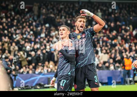 Copenaghen, Danimarca. 13 febbraio 2024. Phil Foden (47) del Manchester City segna per 1-3 e festeggia con Ruben Dias (3) durante la partita di UEFA Champions League tra FC Copenhagen e Manchester City al Parken di Copenaghen. (Photo Credit: Gonzales Photo/Alamy Live News Foto Stock