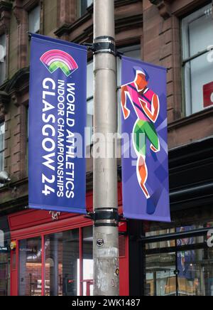 Striscioni per i Campionati mondiali di atletica indoor Glasgow 24, in Buchanan Street, nel centro di Glasgow. La sede dell'evento è l'Emirates Arena. Foto Stock