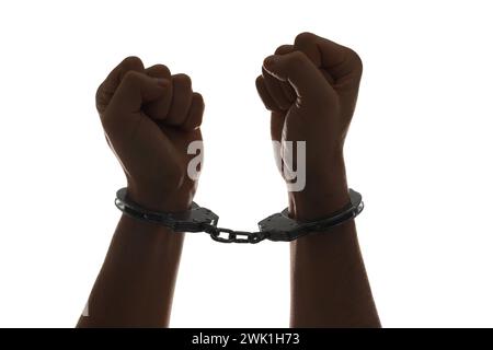 Concetto di libertà. Uomo con le manette sulle mani su sfondo bianco, primo piano Foto Stock