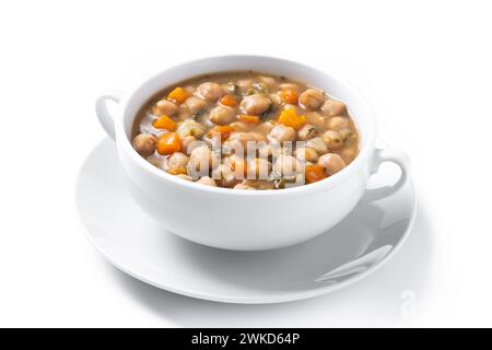 Zuppa di ceci con verdure nel recipiente su un tavolo di legno Foto Stock