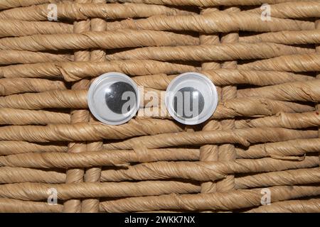 Funny Wiggle Google Eyes on Fabric Silly background Foto Stock