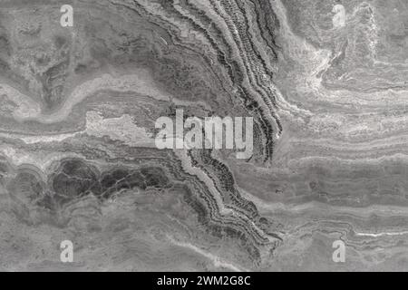 Pietra grigia con un'esclusiva struttura ondulata, struttura granulare porosa di roccia naturale Foto Stock