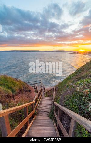 Scale per Exmouth Beach da Orcombe Point at Sunset - Exmouth, Devon, Regno Unito Foto Stock