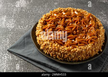 Una torta churros con dulce de leche sopra, dolce dolce dolce dolce Foto Stock
