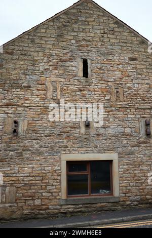 A settembre, un esempio di muratura decorativa in pietra un locale domestico a Foulridge, Lancashire. Foto Stock