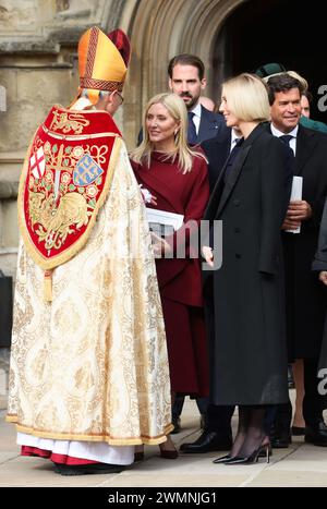 Principessa della Corona Maria Chantal di Grecia, Principe Filippo di Grecia e Danimarca, Principessa Maria Olimpia di Grecia e Danimarca e Carlos Morales partono dopo aver partecipato a un servizio di ringraziamento per la vita di Re Costantino degli Elleni nella Cappella di San Giorgio, nel Castello di Windsor, Berkshire. Data foto: Martedì 27 febbraio 2024. Foto Stock