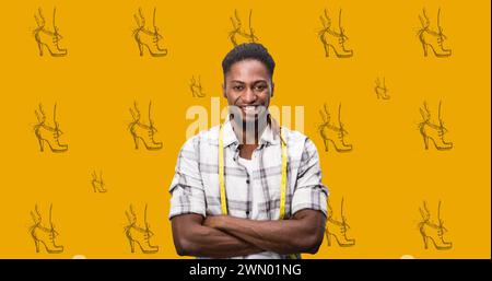 Immagine delle icone delle scarpe e del modello di stilista afroamericano maschile su sfondo arancione Foto Stock