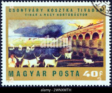 UNGHERIA - 1973 CIRCA: Un francobollo stampato in Ungheria dal numero "dipinti di Csontvary Kosztka" mostra "tempesta su Hortobagy Puszta" Foto Stock