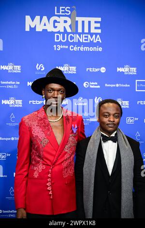 Bruxelles, Belgio. 9 marzo 2024. Il musicista e regista belga Baloji e l'attore Marc Zinga fotografati sul tappeto blu all'arrivo della tredicesima edizione della cerimonia di premiazione del film "Magritte du Cinema", sabato 9 marzo 2024, a Bruxelles. I premi sono premiati per i film di produttori belgi francofoni. BELGA PHOTO LAURIE DIEFFEMBACQ credito: Belga News Agency/Alamy Live News Foto Stock