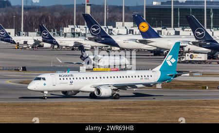 München, Deutschland - 1. Gennaio 2022: Ein Embraer 195LR von Air Dolomiti startet vom Flughafen München. Registrazione i-ADJL. Foto Stock