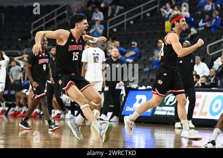 L'attaccante dei Denver Pioneers Pedro Lopez-Sanvicente (15) e la guardia dei Denver Pioneers Jaxon Brenchley (23) escono dal campo dopo aver vinto una semifinale di basket maschile NCAA tra i Denver University Pioneers e l'Università del Nebraska-Omaha Maverics durante i Summit League Championships al Denny Sanford PREMIERE Center di Sioux Falls, SD lunedì 11 marzo 2024. Denver ha vinto 66-63. Russell Hons/CSM Foto Stock