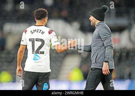 Derby, Regno Unito. 12 marzo 2024. Derby County Manager Paul Warne e centrocampista della Derby County Korey Smith (12) dopo il Derby County FC vs Reading FC Sky bet EFL League 1 match al Pride Park Stadium, Derby, Inghilterra, Regno Unito il 12 marzo 2024 Credit: Every Second Media/Alamy Live News Foto Stock