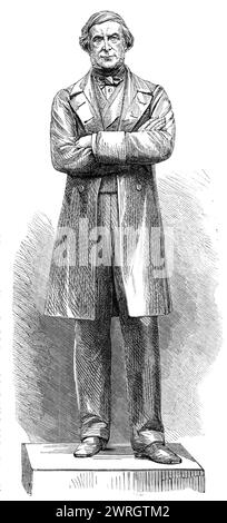 Statua del defunto Sir G. C. Lewis a Hereford, del barone Marochetti, 1864. Gli abitanti della città e della contea di Hereford... hanno sottoscritto una statua del defunto Sir George Cornewall Lewis, il loro vicino ed ex rappresentante... l'artista di questa statua ha prodotto una sorprendente somiglianza di Sir George, che è rappresentato in piedi con le braccia piegate, come nell'atto di rivolgersi a un'assemblea pubblica; e il suo vestito non è quello di un antico oratore o statista classico, ma il semplice camice e pantaloni indossati da un gentiluomo inglese - un costume che, se in qualche modo compromette arti Foto Stock