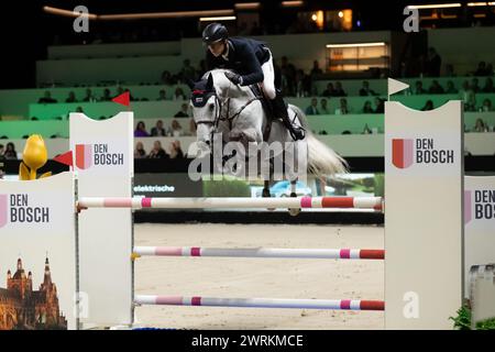 DenBosch, Paesi Bassi - 9 marzo 2024. Max Kuhner dell'Austria in sella a EIC Quantum Robin V gareggia nella classe Indoor Derby di 1,45 m al 2024 olandese Mas Foto Stock