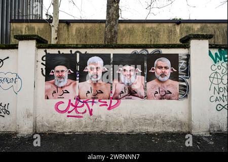 Milano, Italia - 13 marzo 2024: Una serie di opere dell'artista aleXsandro Palombo dal titolo "Haram" (in arabo "proibito") contro il radicalismo e il fondamentalismo islamico. Haram è una campagna di Street art che ritrae i maiali con i leader islamici di Hamas Isma'il Haniyeh, Yahya Sinwar e Khaled Meshal, Hassan Nasrallah, leader di Hezbollah e Ali Khamenei, leader supremo dell'Iran. Sulle opere possiamo leggere la scritta in arabo "Haram”, l'aggettivo che descrive tutto ciò che è severamente vietato nell'Islam, compreso il maiale che i musulmani considerano animali impuri. Foto Stock
