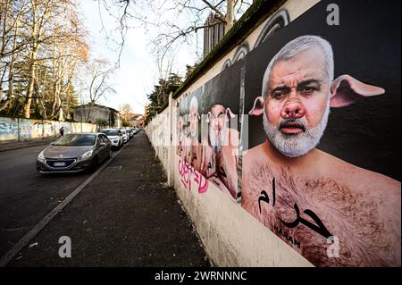 Milano, Italia - 13 marzo 2024: Una serie di opere dell'artista aleXsandro Palombo dal titolo "Haram" (in arabo "proibito") contro il radicalismo e il fondamentalismo islamico. Haram è una campagna di Street art che ritrae i maiali con i leader islamici di Hamas Isma'il Haniyeh, Yahya Sinwar e Khaled Meshal, Hassan Nasrallah, leader di Hezbollah e Ali Khamenei, leader supremo dell'Iran. Sulle opere possiamo leggere la scritta in arabo "Haram”, l'aggettivo che descrive tutto ciò che è severamente vietato nell'Islam, compreso il maiale che i musulmani considerano animali impuri. Foto Stock