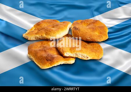 Il prodotto da forno di Aberdeen Rowies o Butteries, prodotto ad Aberdeen, in Scozia. Raffigurata su una bandiera scozzese di salume Foto Stock