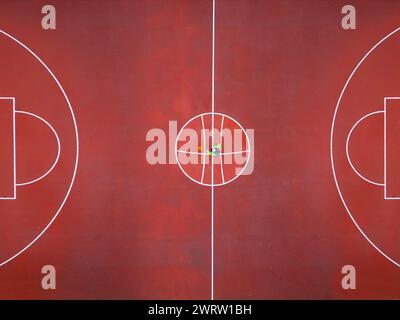 Vista aerea di un uomo che gioca a basket. Concetto di giochi olimpici. Foto Stock